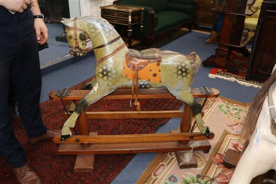 A late Victorian rocking horse on trestle base 107cm